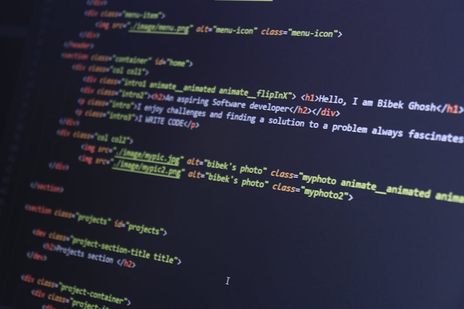 A close-up photograph of a computer screen displaying a dark-themed code editor with lines of HTML and CSS code. The code is organized with tags such as <DOCTYPE html>, <html>, <head>